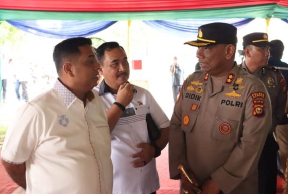 Polres Kampar Perketat Pengamanan M. Nasir Anggota DPR RI Komisi VII Tinjau Lokasi Pendistribusian